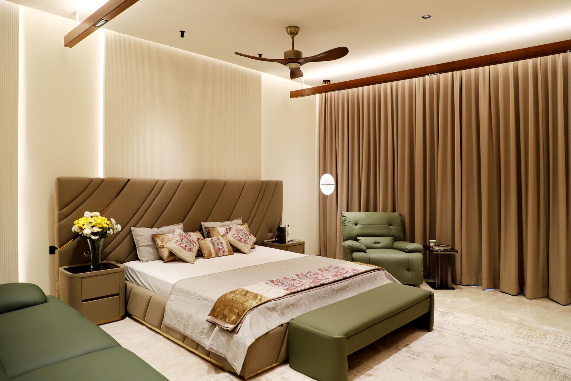 A bright, minimal primary suite with soft linens